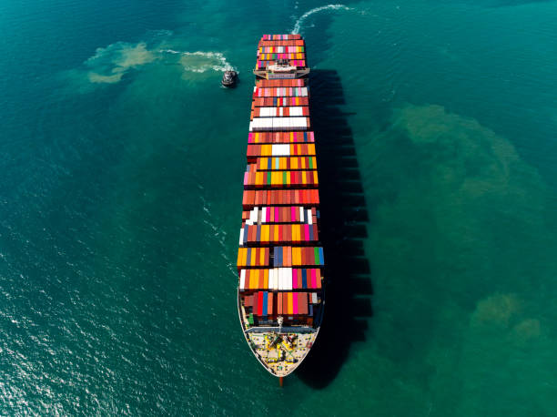 istock aerial top view cargo logistic container ship sailing in sea, import export goods and distributing products to dealer and consumers across worldwide, 2193237488