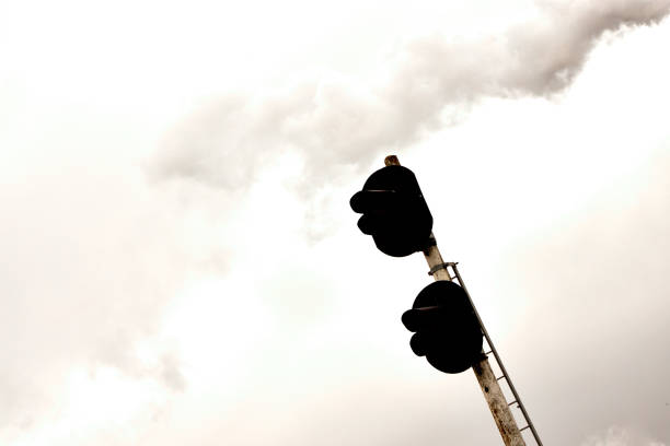 industrial landscape, black retro lantern against gray sky