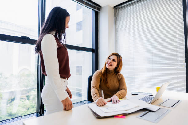 istock Coworkers talking on the office 2193242273