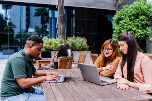 istock Coworkers using laptop outdoors 2193243671