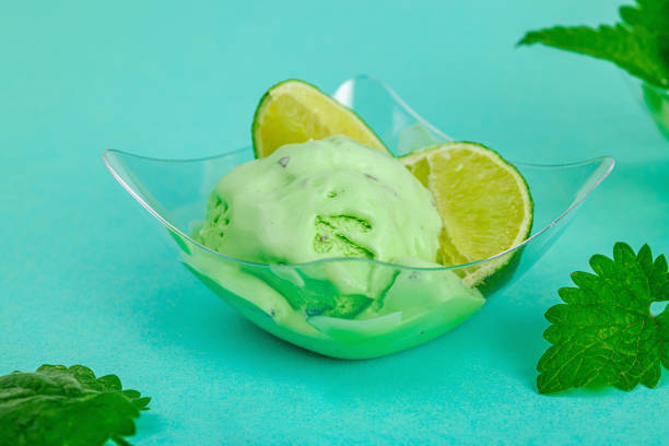 Trendy lemon balm ice cream. Chocolate drops, fresh leaves, ripe lemons. Refreshing summer dessert