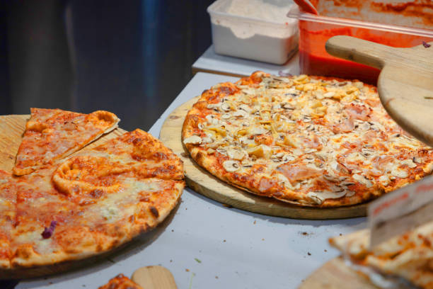 istock two Sliced hot pizza slice melting cheese. 2193248466