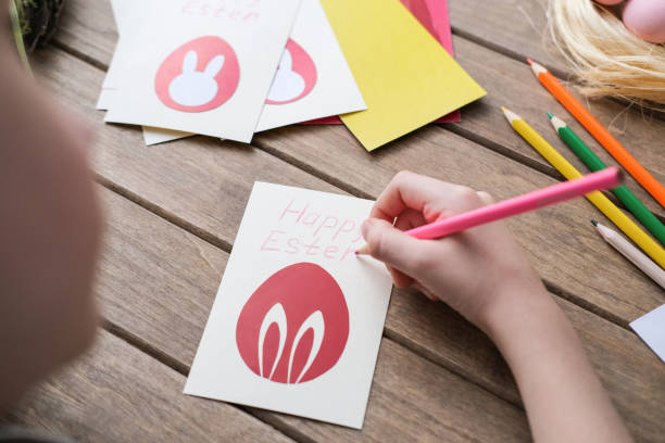 istock Boy making Easter greeting card. Materials for art creativity on kid table, children painting. Paper crafts activity in kindergarten or learning at home 2193248806