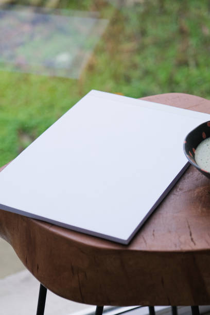 istock blank magazine mockup on coffee table with green matcha tea near window 2193251693