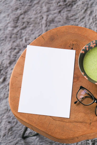 istock blank paper sheet mockup on coffee table with green matcha tea 2193251759
