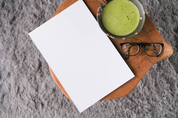 istock blank magazine mockup on coffee table with green matcha tea 2193251803