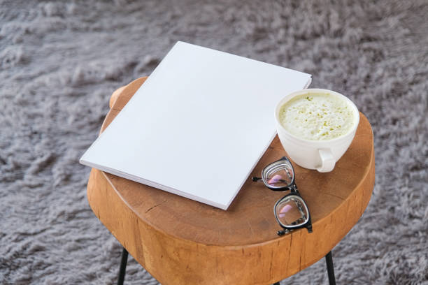 istock blank magazine mockup on coffee table with green matcha tea near window 2193251978