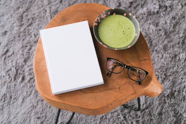 blank book mockup on wooden coffee table with green matcha tea and glasses, asian style