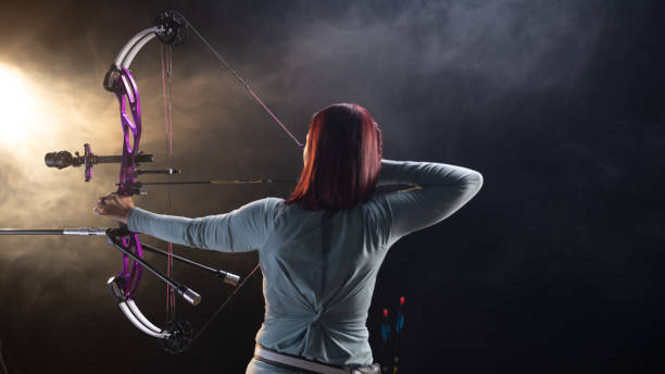 istock Focused Caucasian Female Archer with Bow in Studio 2193253731