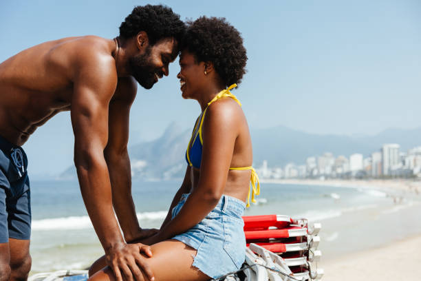 istock Affectionate couple enjoying a sunny day in Rio de Janeiro beach 2193254545