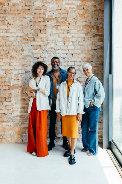 istock Group of professionals standing confidently against a brick wall 2193254638