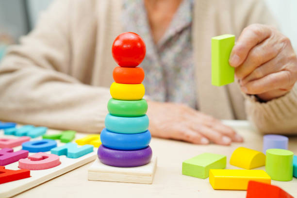 istock Asian elderly woman playing game. 2193256459