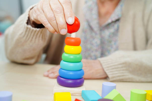 istock Asian elderly woman playing game. 2193256464