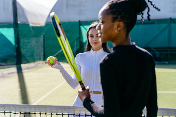 istock Two female tennis partners with rackets. 2193257677