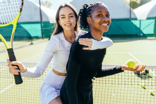 istock Two playful multiethnic female friends having fun hugging together 2193257787