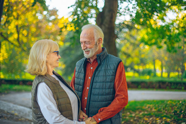 istock Happy senior couple having fun in the park 2193262247