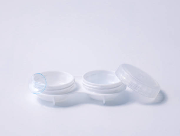 istock White contact lens case with a transparent lens on one side, placed on a clean white background. Minimalist design representing vision correction, hygiene, and eye care essentials 2193264772