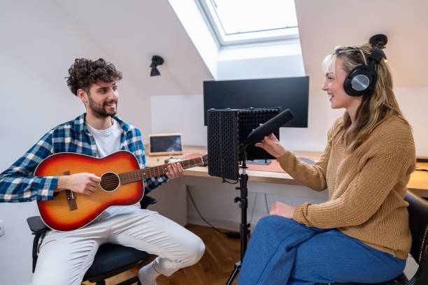 istock Two talented friends composing a new song in their home music studio setup 2193265067