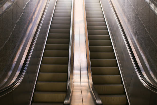 istock Modern underground architecture background. Escalators leading to a train platform. Pedestrian walkway. 2193268133