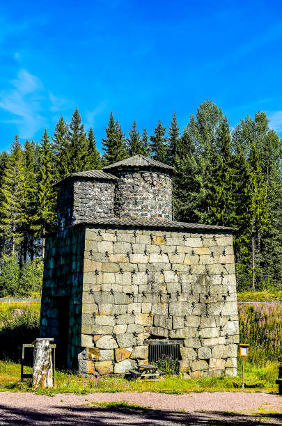 istock A stone building with a small roof sits in a forest 2193268859