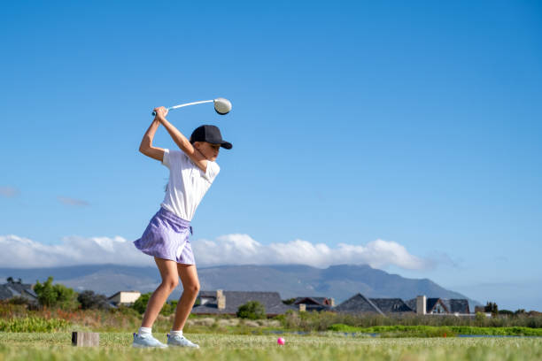 istock Determined young girl hitting ball with club 2193271180