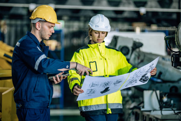 istock Inspecting Printed Circuit Board (PCB) in a Factory 2193272199