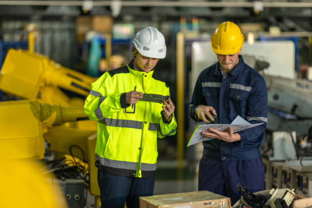 istock Inspecting Printed Circuit Board (PCB) in a Factory 2193272468
