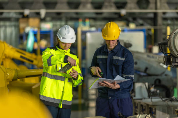 istock Inspecting Printed Circuit Board (PCB) in a Factory 2193272517