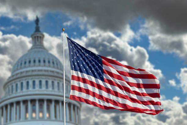 istock Capitol Building and American Flag 2193275144