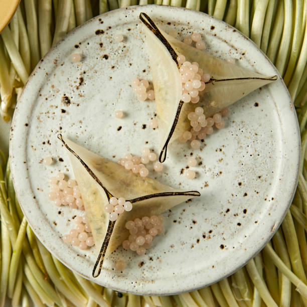 istock appetizers with caviar on a white round plate. 2193275242