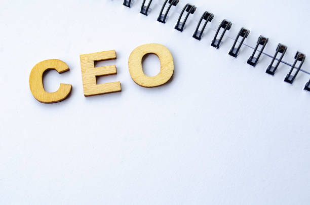 istock CEO wooden letters on white notepad. CEO representing Chief Executive Officer 2193278294