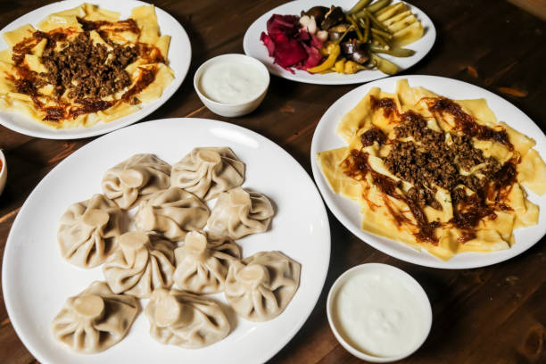 istock Delicious dumplings and savory appetizers on a wooden table 2193279307