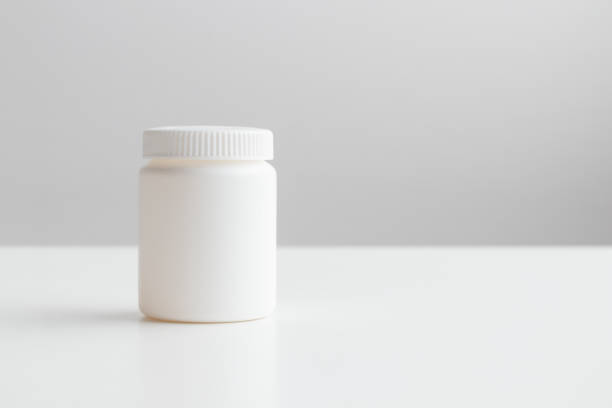 Blank white vitamin bottle. Unlabeled white nutritional supplement jar on white backdrop, custom branding, dietary product mockup, clean medicine bottle design, health care packaging presentation