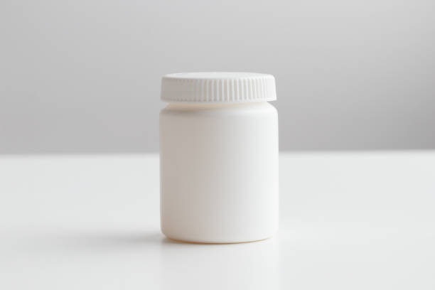 istock Blank white vitamin bottle. Unlabeled white nutritional supplement jar on white backdrop, custom branding, dietary product mockup, clean medicine bottle design, health care packaging presentation 2193279478
