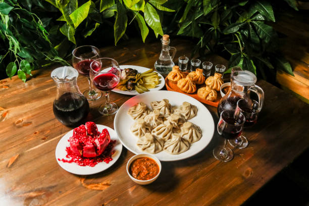 Samosas, dumplings, and fruity drinks display on wooden table