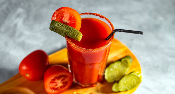 istock Refreshing vegetable cocktail. Tomato juice served in glass with tomatoes and pickles. Image for menu, bars, restaurants 2193280768
