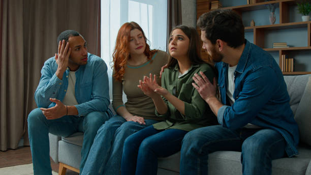 istock Multiracial 30s diverse people sit indoors sad crying woman sharing life problem grief. Caring friends women men consoling hugging provide psychological help support empathy on group therapy meeting 2193281775