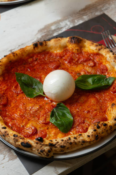 istock Pizza at the table with alcoholic drink vegetables mozzarella and meat 2193281915