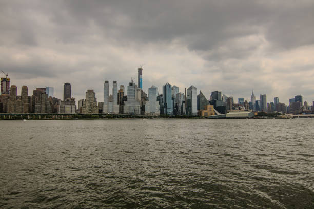 A stunning view of the Manhattan skyline under dark clouds