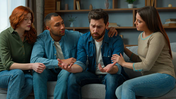 istock Sad desperate upset caucasian adult 30s man share life problem grief in group therapy session at home diverse people multiracial friends women men helping supporting give psychological help empathy 2193283156