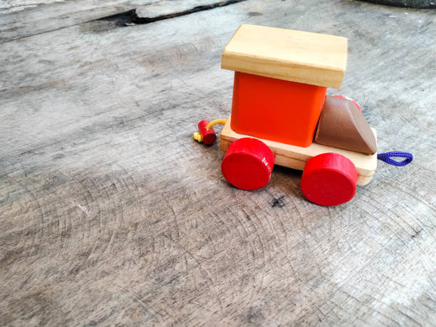 A wooden toy car on a white background