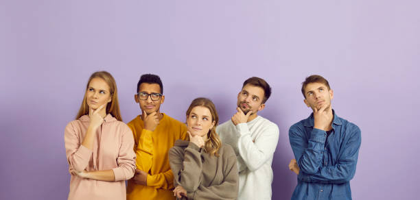 istock Group of young people puzzled by difficult question are thinking hard and doubting 2193287385