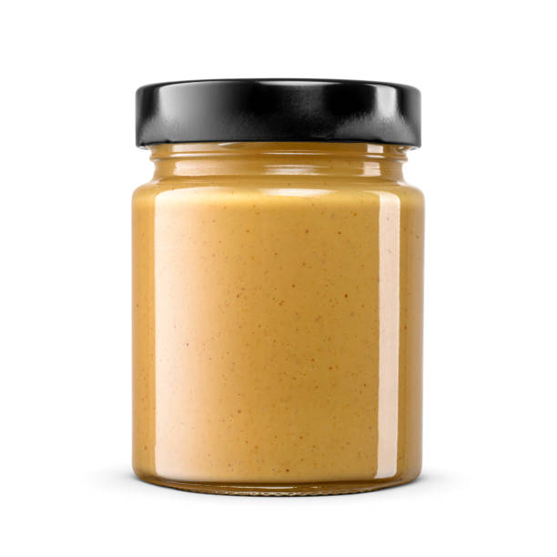 istock Peanut butter glass jar with black lid without label isolated on white. 2193287695
