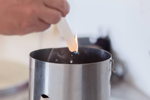istock Close up to the safe lighting of charcoal from a vertical smoker using candle wax 2193288564