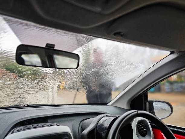 istock Man using self-service car wash on gas station forecourt 2193289341