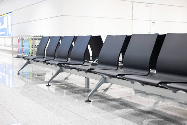 istock Empty chairs inside international airport waiting lounge near gate at night 2193292000