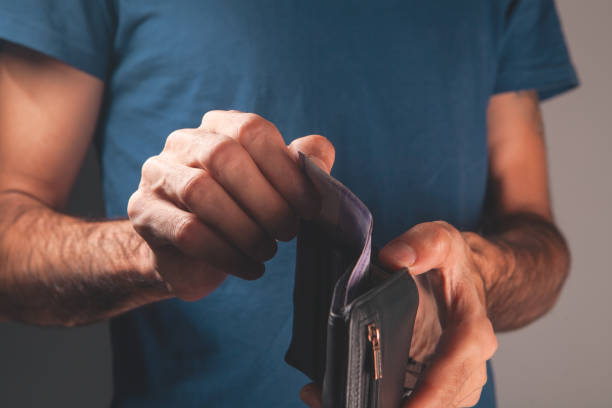 istock a man holds a wallet in his hand 2193292106