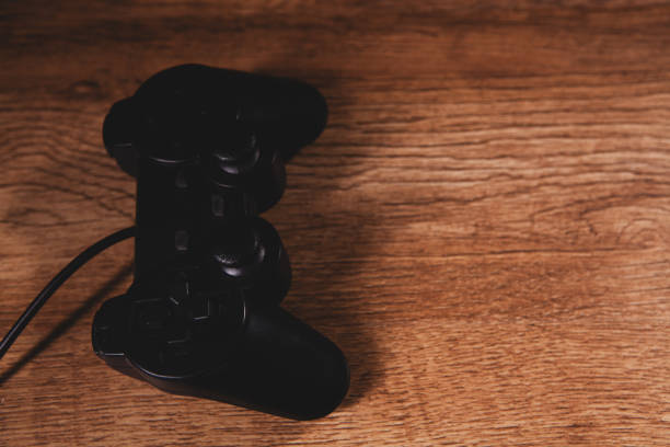 Close-Up Of Vintage Joystick On White Background
