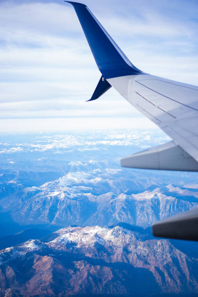 istock Airplane Wing Aerial View of Mountains Daytime 2193293678