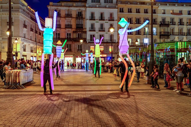 Tourists are enjoying a light show in Plaza Mayor during Spanish National Day, Madrid, Spain.